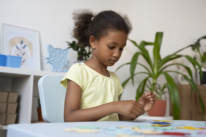side-view-girl-making-puzzle-table